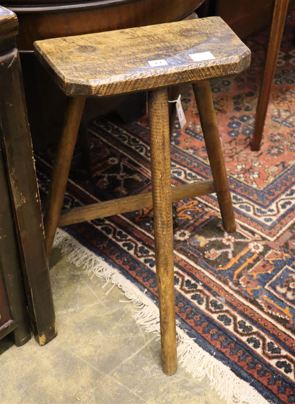 A 19th century primitive ash and elm coffin stool, height 67cm